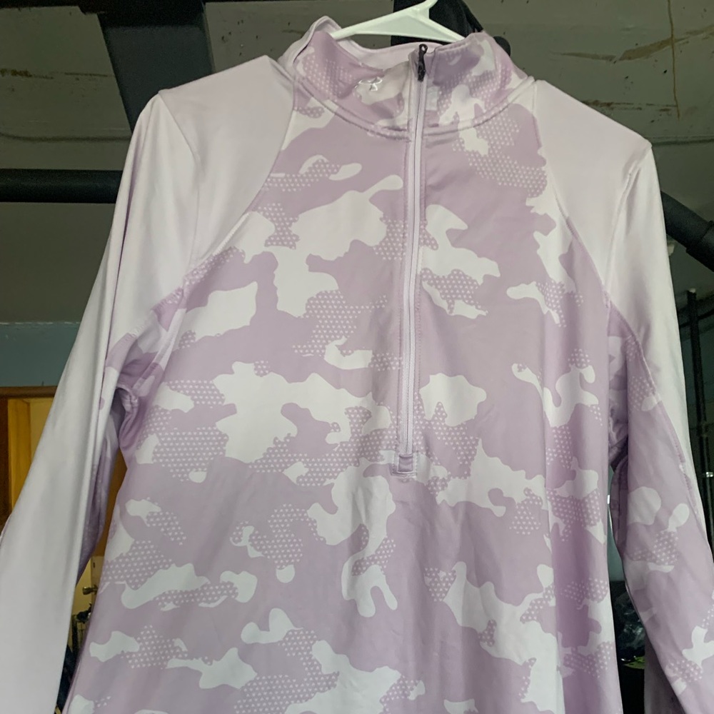 Brand new without tags under armour half zip outerwear. Light purple/pink camo.